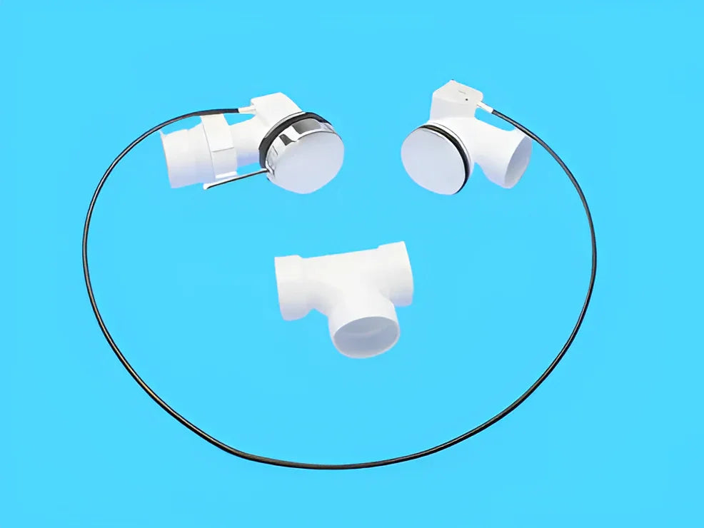 White jetted tub replacement parts including jets and T-fitting on blue background