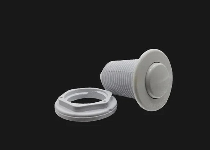 White whirlpool tub air switch button replacement part on black background