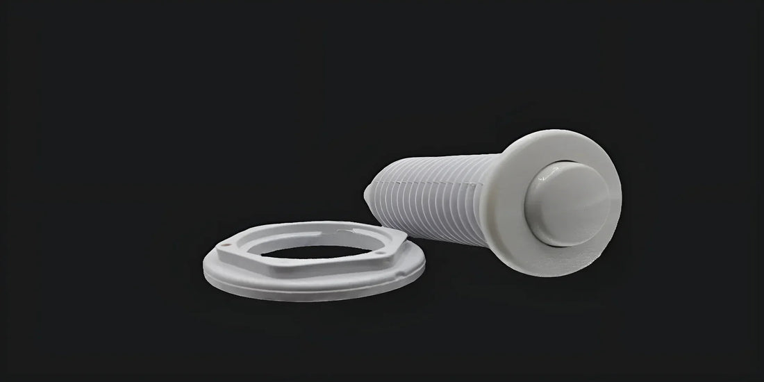 White air switch button and mounting nut for jetted tub replacement on black background