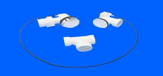 White bathtub drain parts and cable set for whirlpool tub repair on blue background
