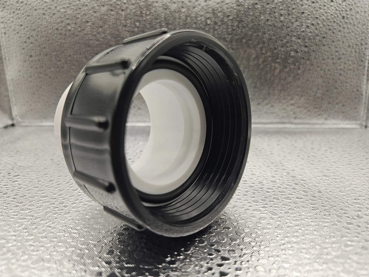 White Balboa Water Group Ultima 1.5-inch pump union for spa or pool equipment, made of durable white plastic.