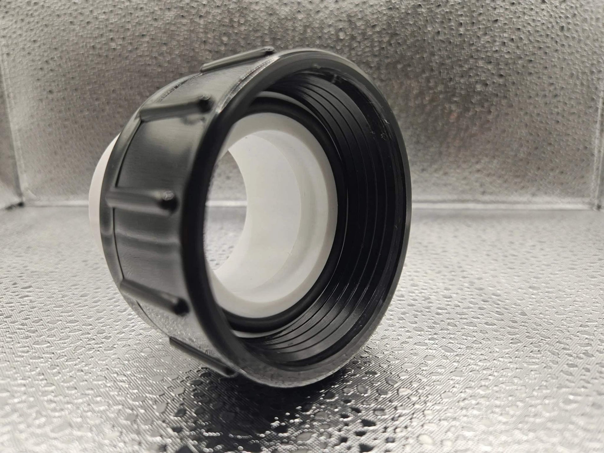 White Balboa Water Group Ultima 1.5-inch pump union for spa or pool equipment, made of durable white plastic.